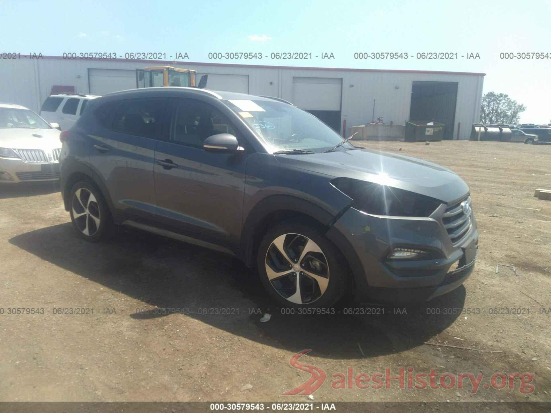 KM8J3CA2XGU058077 2016 HYUNDAI TUCSON