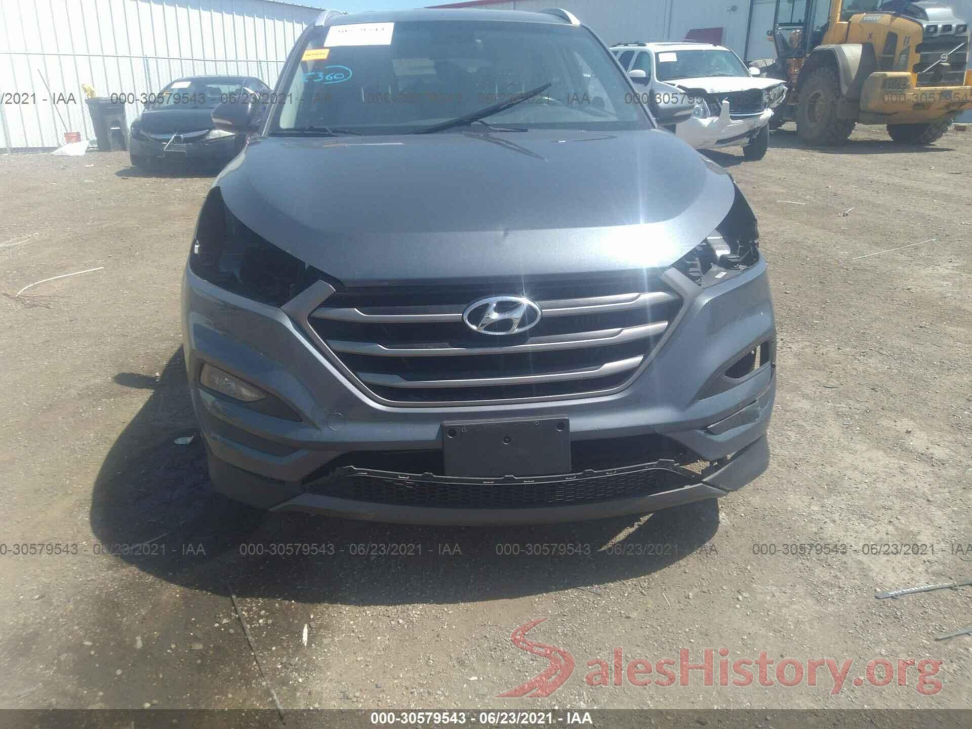 KM8J3CA2XGU058077 2016 HYUNDAI TUCSON